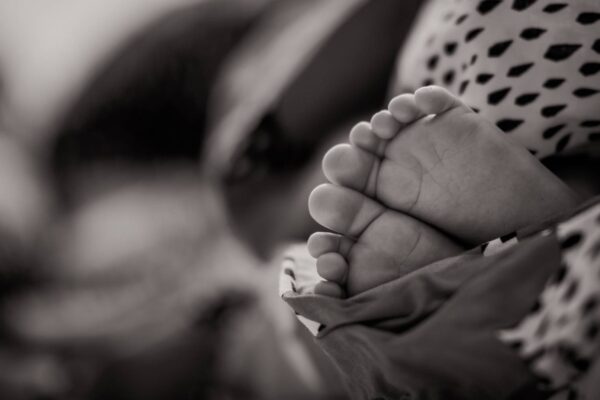 newborn baby feet in black and white