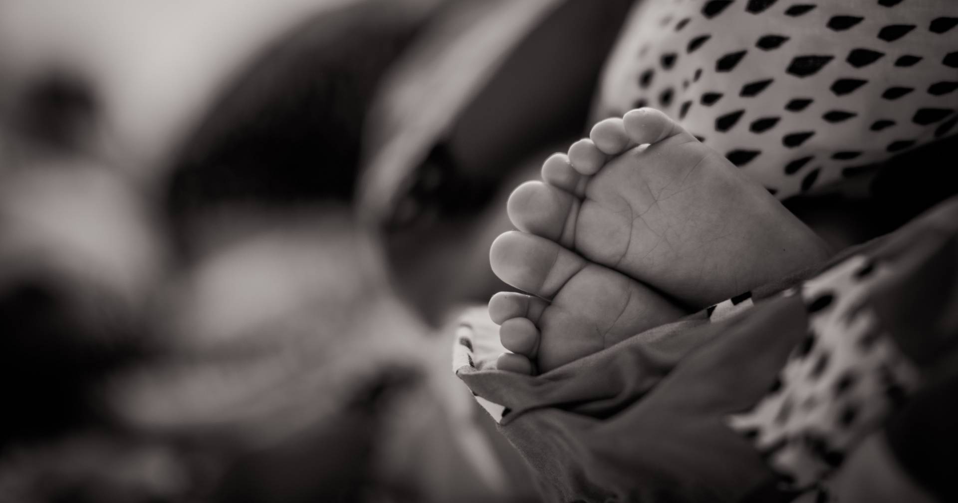 newborn baby feet in black and white